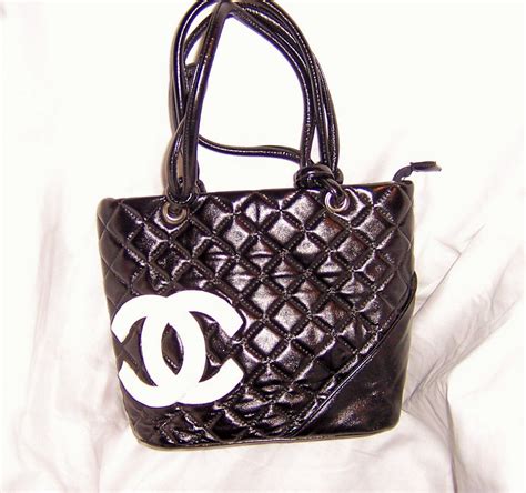 black chanel purse with white logo|expensive black purses quilted chanel.